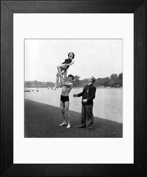 Framed Print : Entertainment : Humour. Mr. George Jakubowski showing off his new strength to Mr
