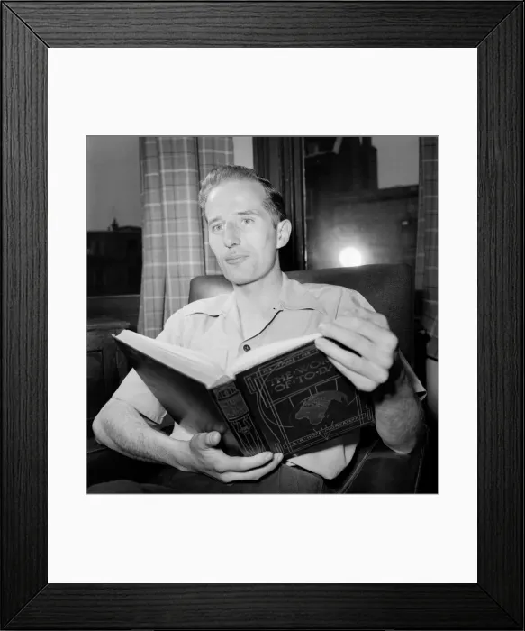 Framed Print : Families. Man Reading book. July 1953 D3424-001