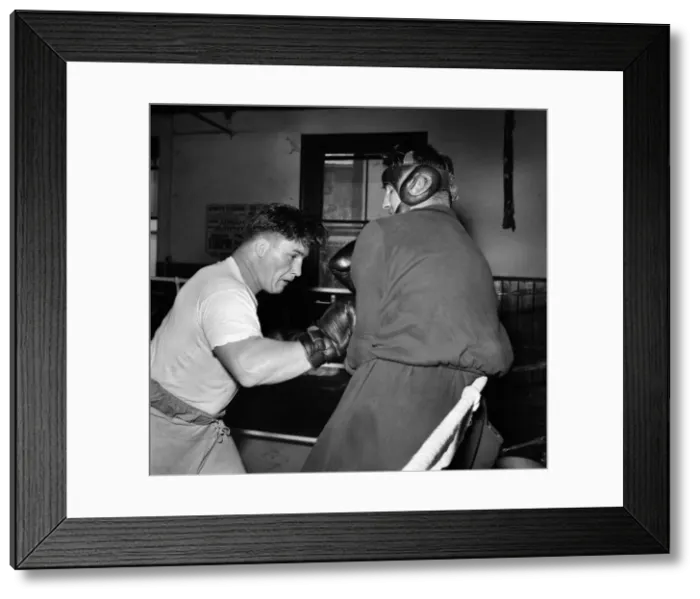 Framed Print : Boxer Don Cockell seen here Training in a Brighton Gym for his next fight his sparring Framed Print : Boxer Don Cockell seen here Training in a Brighton Gym for his next fight his sparring
