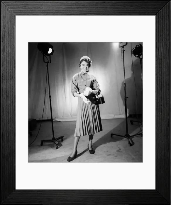 Framed Print : Model Jackie Jackson wearing a dress, white gloves, hat and carrying a handbag Framed Print : Model Jackie Jackson wearing a dress, white gloves, hat and carrying a handbag