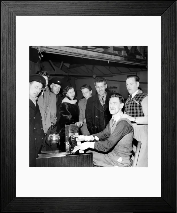 Framed Print : Syncopating Sandy sitting at his piano participating in a non-stop playing marathon