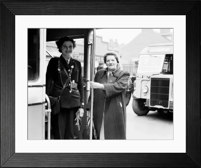 Framed Print : Public Transport Buses. Woman thanks helpful conductoress with a cheerful goodbye on a Framed Print : Public Transport Buses. Woman thanks helpful conductoress with a cheerful goodbye on a