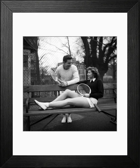 Framed Print : Man and woman talking on a park bench after enjoying a game of tennis January