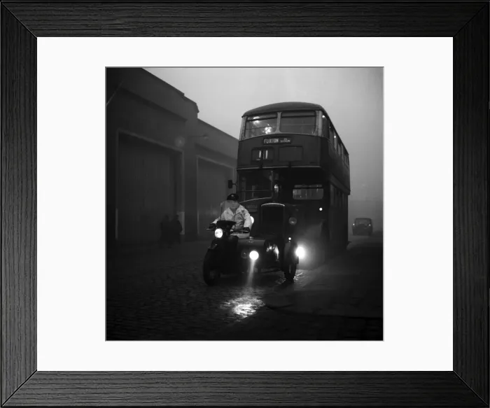 Framed Print : A bus being led by a motor cycle combination fitted with a special battary of lights Framed Print : A bus being led by a motor cycle combination fitted with a special battary of lights