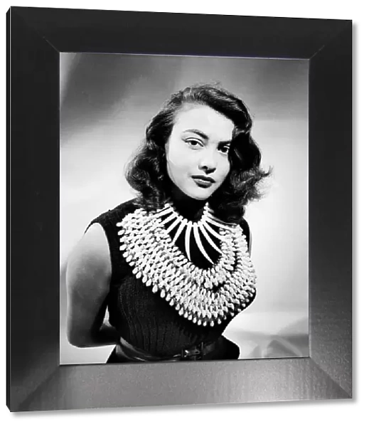 Film actress Tessa Prendergast a wearing a necklace. January 1953 D471