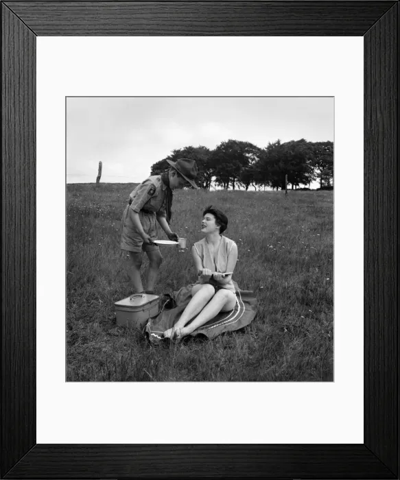 Framed Print : Children Humour - Boy Scout Ronald Shepherd with sun bathing beauty queen Jacqueline
