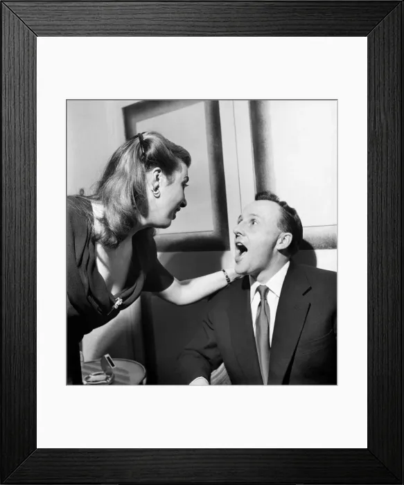 Framed Print : Jackie Buckland, one of his fans, examines Jimmy Young