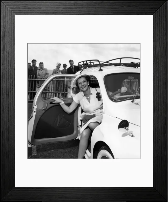 Framed Print : Mrs. Gordan Offord poses in a car during the Brighton beauty contest Framed Print : Mrs. Gordan Offord poses in a car during the Brighton beauty contest