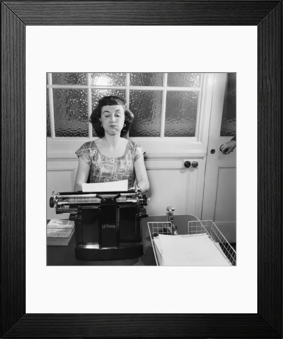 Framed Print : Bored Secretary Puffs at her Cheeks. July 1953 D3421 Framed Print : Bored Secretary Puffs at her Cheeks. July 1953 D3421