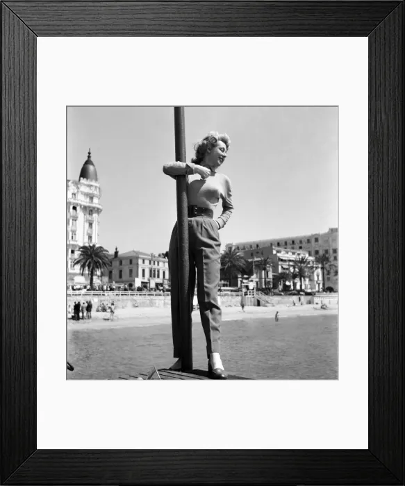 Framed Print : Cannes Film Festival 1953. France Roche seen here on the sea front at Cannes. D3118 Framed Print : Cannes Film Festival 1953. France Roche seen here on the sea front at Cannes. D3118