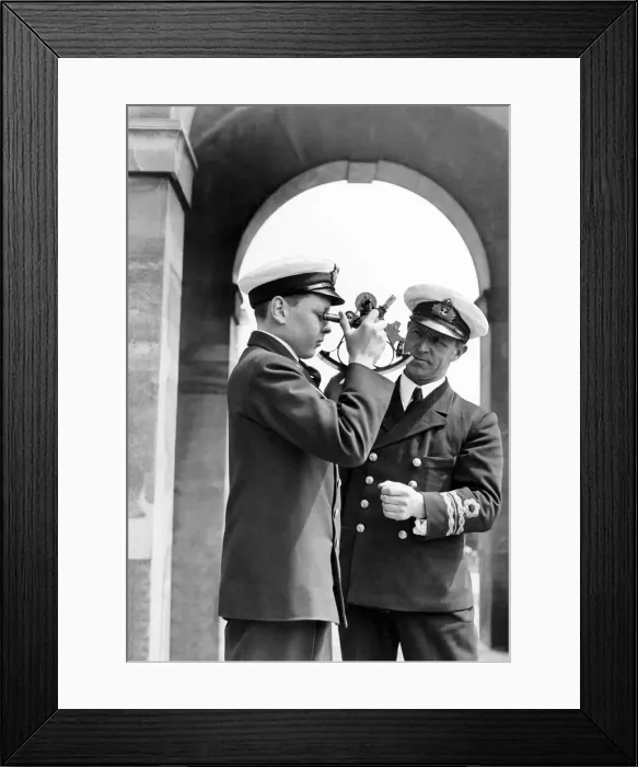 Framed Print : Lt. Commander J. H. Blair D. C. S. seen here teaching a naval cadet how to use a sexton