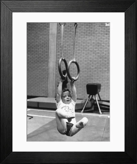 Framed Print : Children Gymnastics Swinging toddler in Lewisham gym is allowed to play