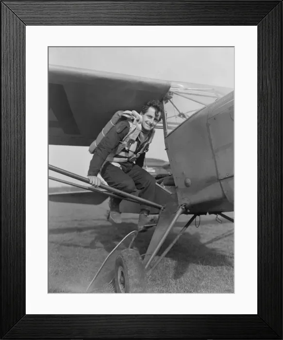 Framed Print : Dumbo Williams film stunt man seen here climbing into a Auster light aircraft Framed Print : Dumbo Williams film stunt man seen here climbing into a Auster light aircraft