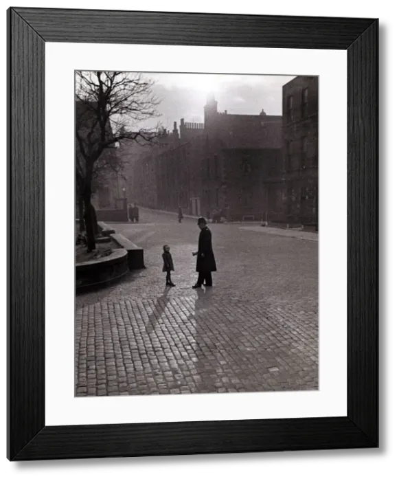 Framed Print : Edinburgh street scenes Policeman talking to lost child on a cobbled street in Framed Print : Edinburgh street scenes Policeman talking to lost child on a cobbled street in