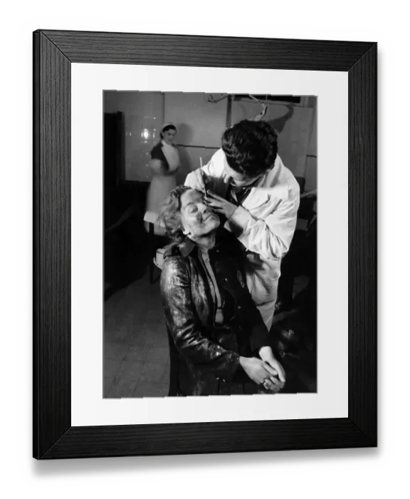 Framed Print : A member of the AFS Fire Service seen here receiving treatment for an eye injury Framed Print : A member of the AFS Fire Service seen here receiving treatment for an eye injury