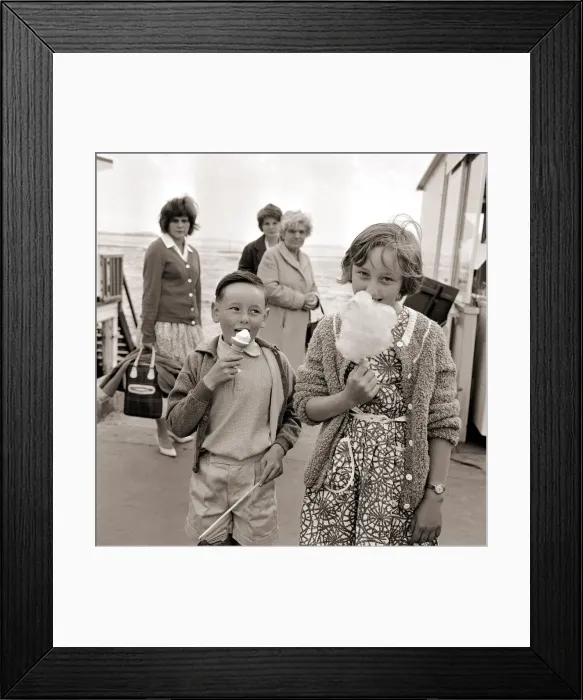 Framed Print : Holiday Resorts at Southend in Essex Two Young children eating a icecream Framed Print : Holiday Resorts at Southend in Essex Two Young children eating a icecream