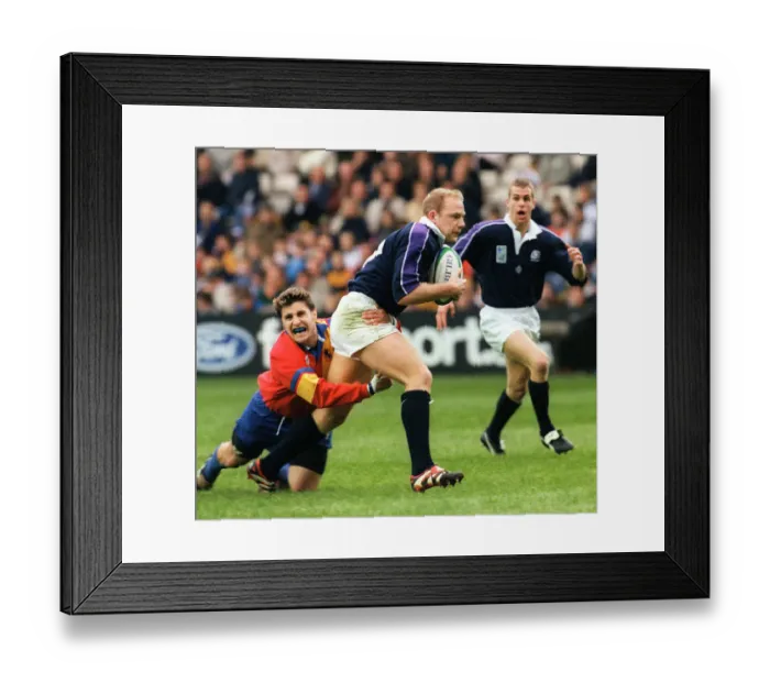Framed Print : Duncan Hodge holds ball for Scotland October 1999 as he is tackled by Andrei Kovalenco of Framed Print : Duncan Hodge holds ball for Scotland October 1999 as he is tackled by Andrei Kovalenco of