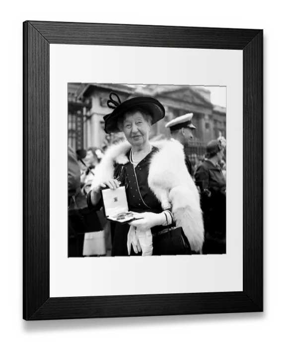 Framed Print : Investiture, Buckingham, Palace'. Miss M. Bradden, seen here with her M. B