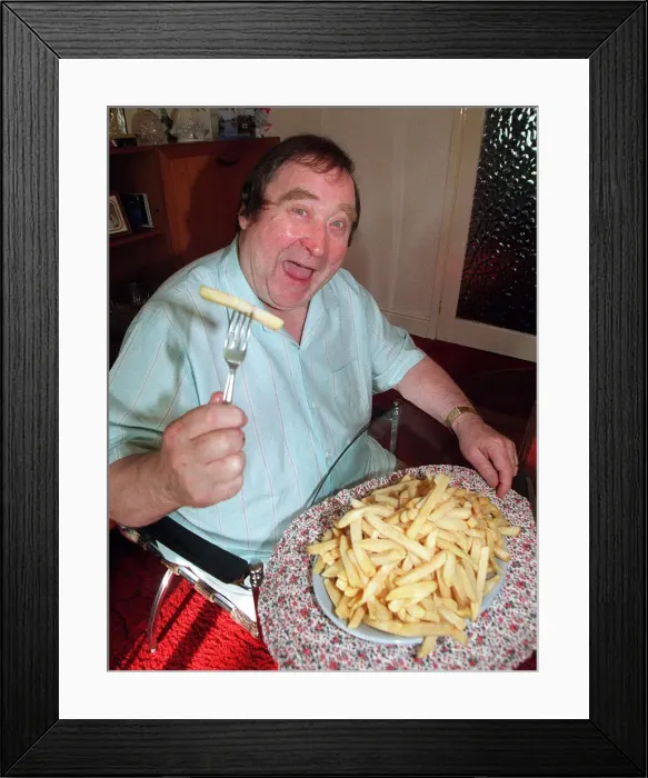 Framed Print : Bernard Manning comedian with plate of McCains Less fat chips