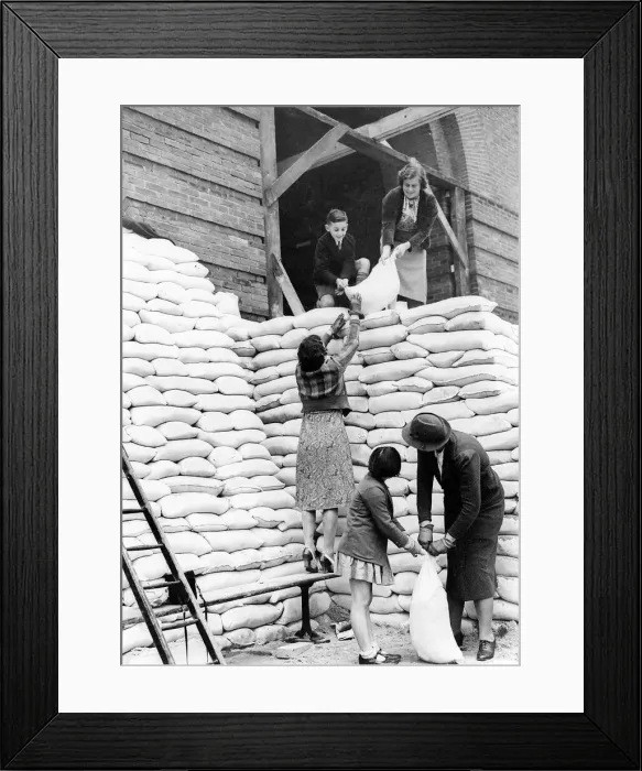 Framed Print : Women during WW2 - 1939 Parents and children help to sandbag the main entrance to Framed Print : Women during WW2 - 1939 Parents and children help to sandbag the main entrance to