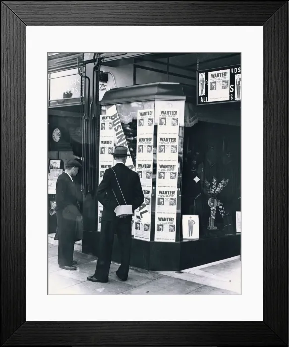 Framed Print : A passer-by look at a tailor shop window plastered with copies of the Daily Mirror Hitler Framed Print : A passer-by look at a tailor shop window plastered with copies of the Daily Mirror Hitler