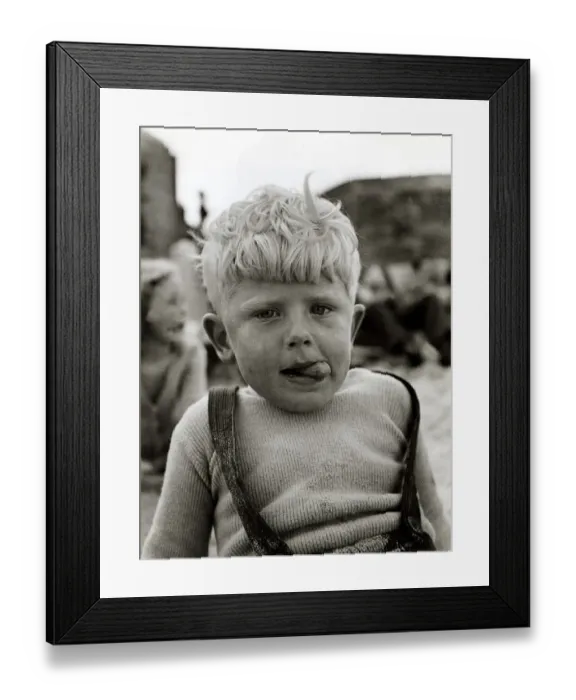 Framed Print : Little boy with sand all over him, tousled hair and ice cream tongue sticking out his Framed Print : Little boy with sand all over him, tousled hair and ice cream tongue sticking out his