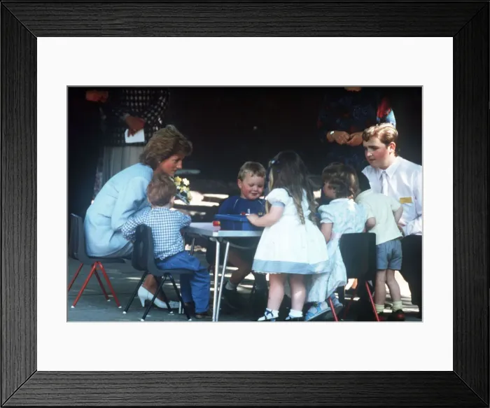 Framed Print : Princess Diana pictured with nursery school children during a visit to the Barnardo