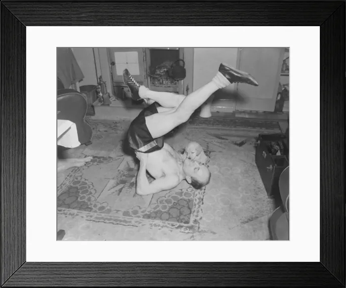 Framed Print : Boxing Teddy Gardner in training with his puppy watching Framed Print : Boxing Teddy Gardner in training with his puppy watching