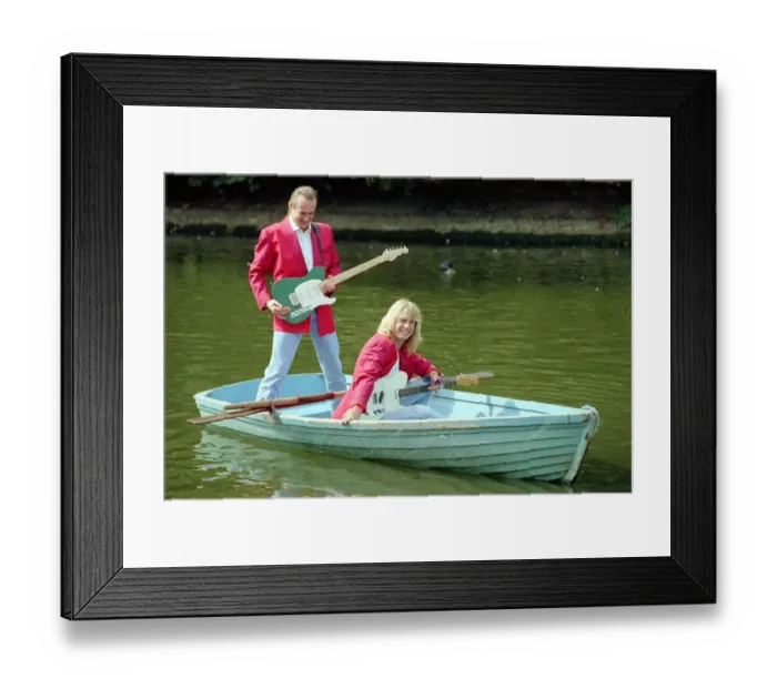 Framed Print : Status Quo wearing red coats at Butlins holiday camp. September 1990 1990s Framed Print : Status Quo wearing red coats at Butlins holiday camp. September 1990 1990s