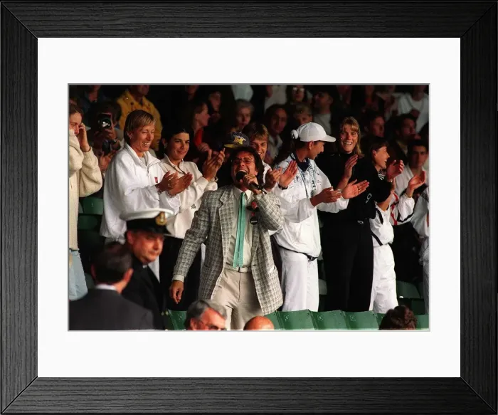 Framed Print : Sir Cliff Richard sings for spectators as rain suspends play on Wimbledon Framed Print : Sir Cliff Richard sings for spectators as rain suspends play on Wimbledon