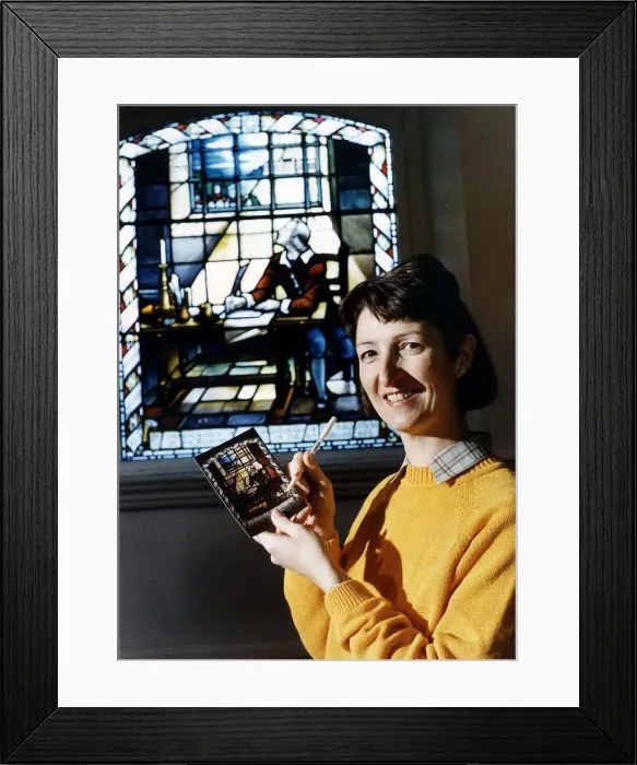 Framed Print : Joy Brodier stands in front of the window at the Bunyan Freechurch at Bedford pictured