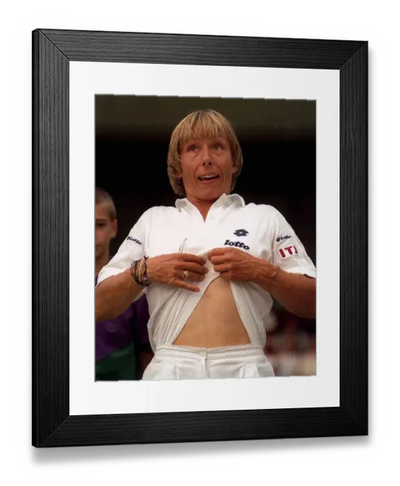 Framed Print : Martina Navratilova has the crowd in stitches as she apes Andre Agassi Framed Print : Martina Navratilova has the crowd in stitches as she apes Andre Agassi