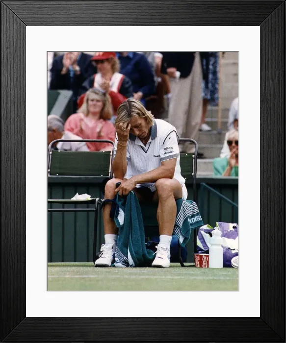 Framed Print : Martina Navratilova hangs her head in despair after Monica Seles had bundled her out of