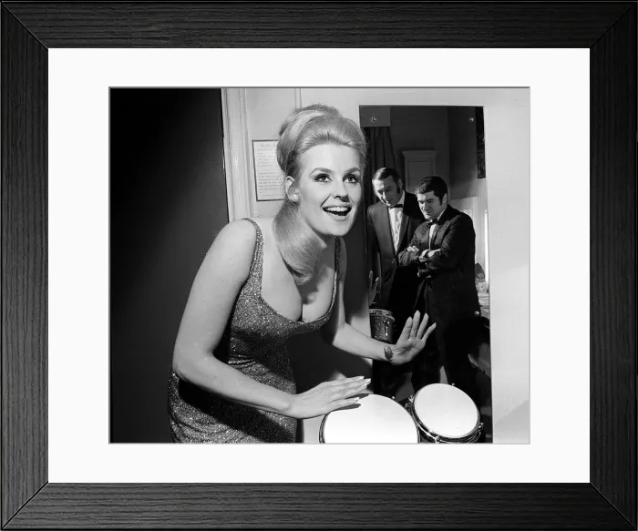 Framed Print : Lesley Langley April 1967 former Miss World on the bongo watched by her new partners jazz