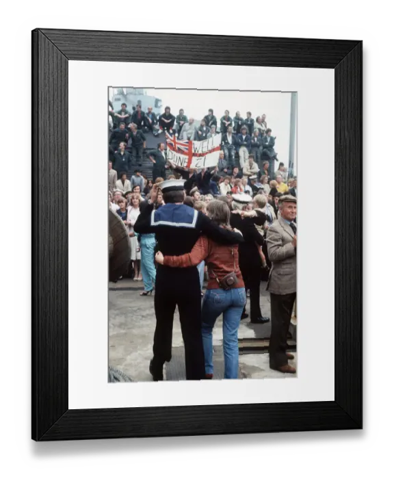 Framed Print : HMS Arrow Falklands War a sailor walks along arm in arm with his wife after arriving back