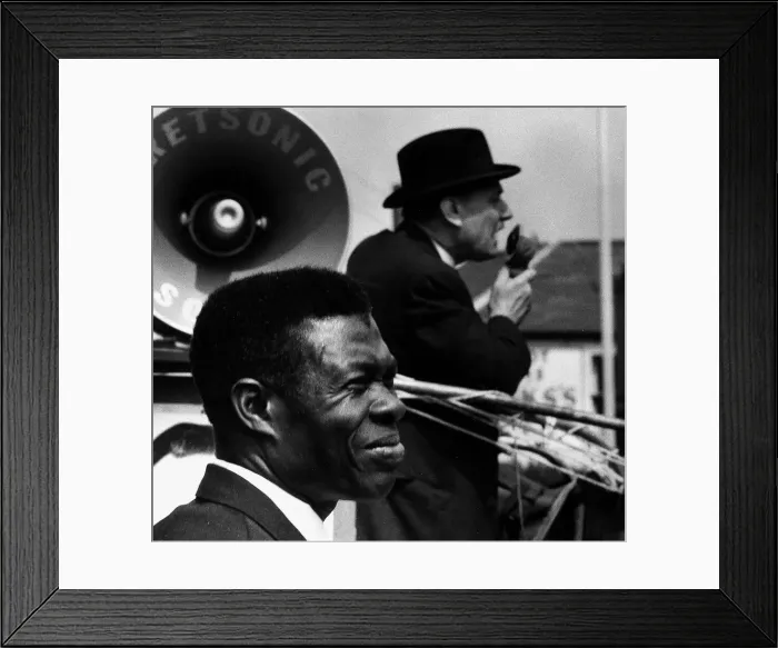 Framed Print : General Election 1970 Enoch Powell canvassing with a microphone with a black man standing Framed Print : General Election 1970 Enoch Powell canvassing with a microphone with a black man standing