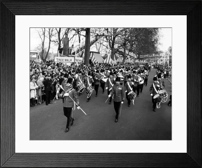 Framed Print : A military band leads the Battersea Easter Parade of 1971 as crowds gather to watch Framed Print : A military band leads the Battersea Easter Parade of 1971 as crowds gather to watch