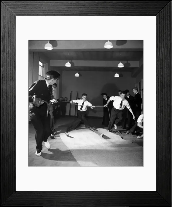 Framed Print : Ski-ing Instruction at a London Nautical School. December 1952 C6051 Framed Print : Ski-ing Instruction at a London Nautical School. December 1952 C6051
