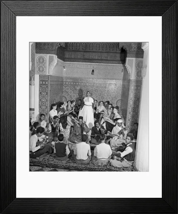 Framed Print : A group of French actresses enjoying a performance by local musicians