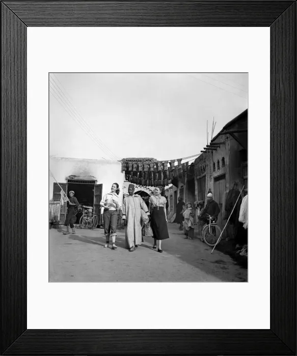 Framed Print : Two French actresses walk through the streets and market square in Marrakech