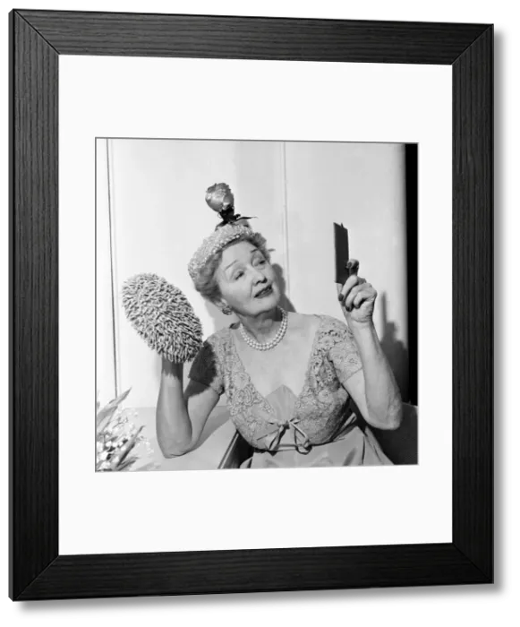 Framed Print : Hedda Hopper who is going to present to the Queen two of her fantastic hats