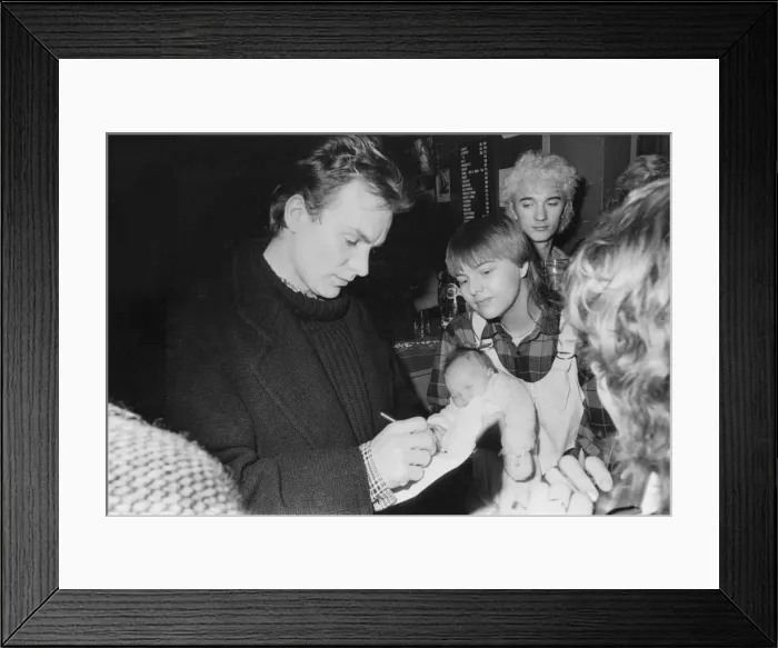 Framed Print : Sting signs his autograph for Jackie Kerr, holding her eight-week-old baby, Paula Framed Print : Sting signs his autograph for Jackie Kerr, holding her eight-week-old baby, Paula
