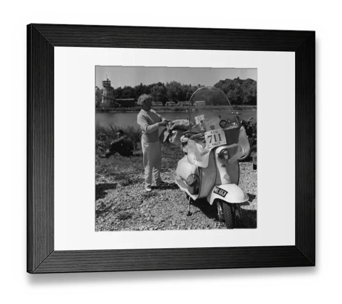 Framed Print : Scooter rally 1958 Woman checks bags Final preparations before Framed Print : Scooter rally 1958 Woman checks bags Final preparations before