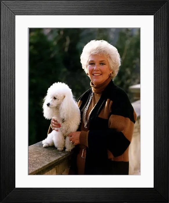 Framed Print : Katie Boyle columnist standing on a bridge with her dog Framed Print : Katie Boyle columnist standing on a bridge with her dog