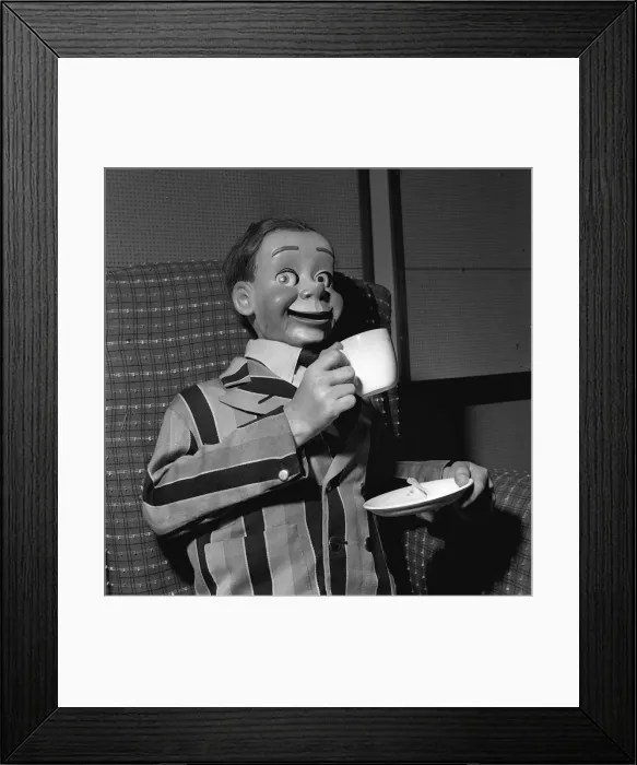 Framed Print : Archie Andrews 1958 ventriloquists dummy drinking from cup holding saucer