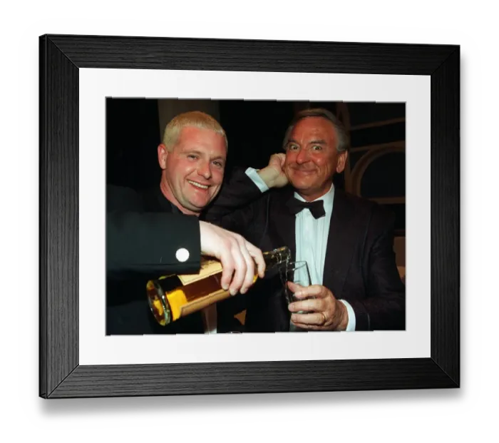 Framed Print : Paul Gascoigne gives Bob Monkhouse pours from bottle glass whisky Ibrox last night Framed Print : Paul Gascoigne gives Bob Monkhouse pours from bottle glass whisky Ibrox last night