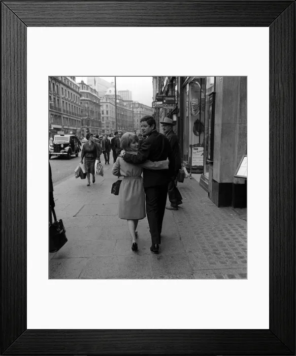 Framed Print : Petula Clark and her husband Claude Wolff go shopping in Regent Street when they were