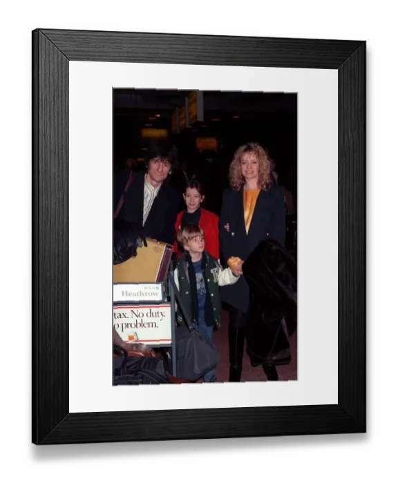 Framed Print : Ronnie Wood and family arriving at Heathrow airport in February 1990