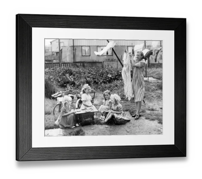 Framed Print : Its best crockery and cakes time for little Rosamund McCloskey who is giving a tea Framed Print : Its best crockery and cakes time for little Rosamund McCloskey who is giving a tea