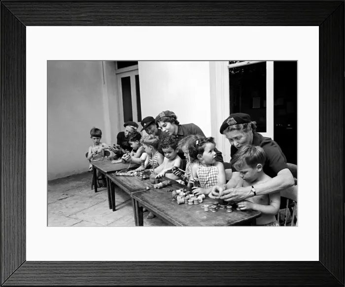 Framed Print : Children playing with cotton reels at Hollyshaw Residential Nursery